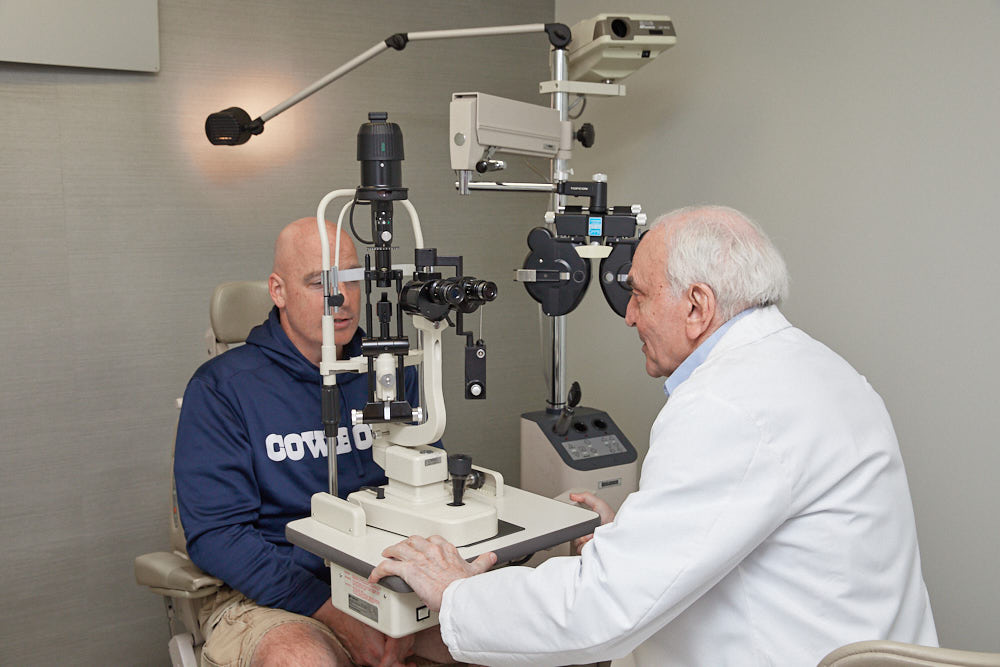 LASIK Sugeon Dr. Joseph Dello Russo doing eye exam of a patient